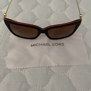 Sunglasses with an orange trim on top